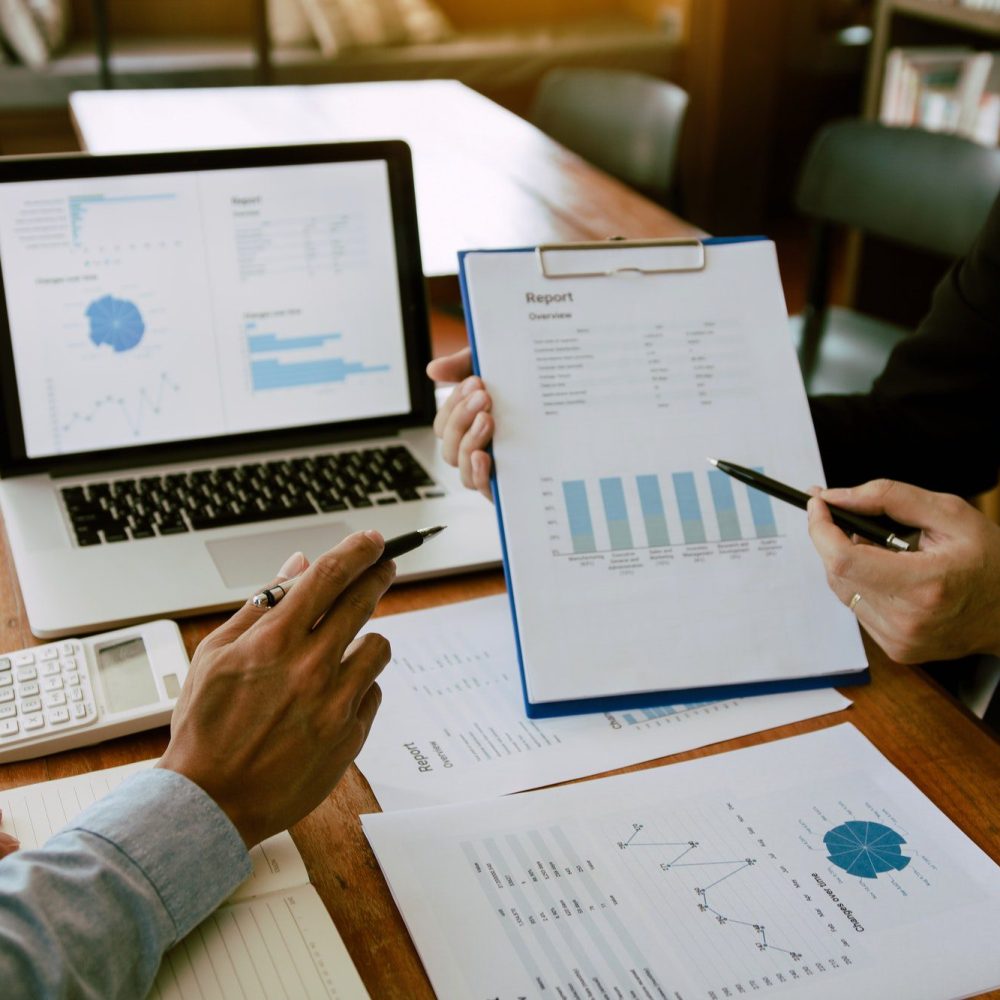 two-business-partnership-coworkers-analysis-strategy-with-discussing-a-financial-planning-graph-and.jpg Accounting Services